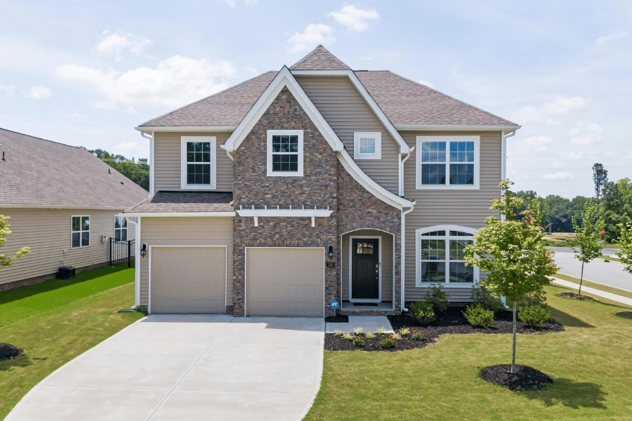 Beautiful residential home in Durham, NC with a brick facade and two garages